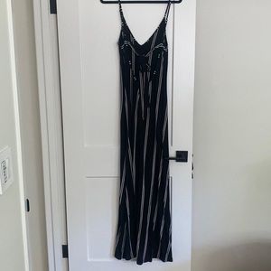 Black stripped maxi dress with slit up the leg.